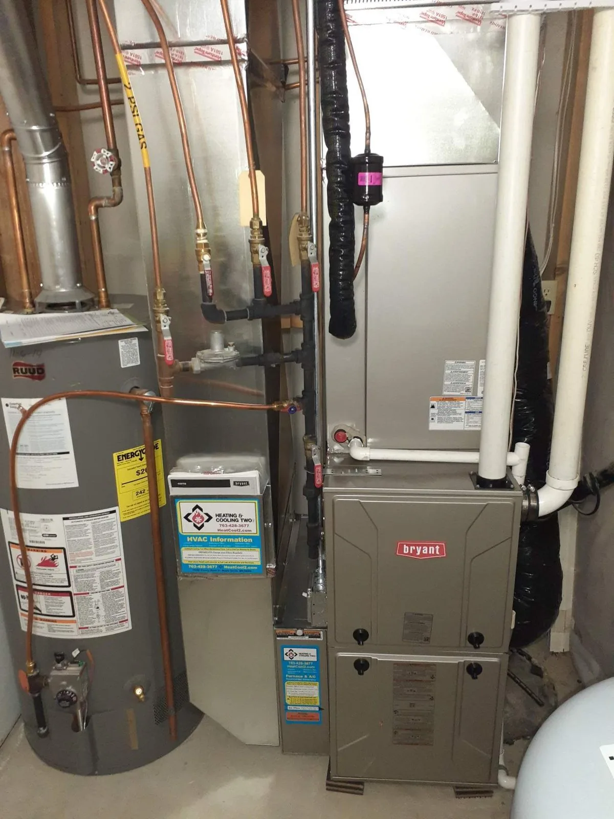 Water heater and high-efficiency furnace installed side by side in a basement