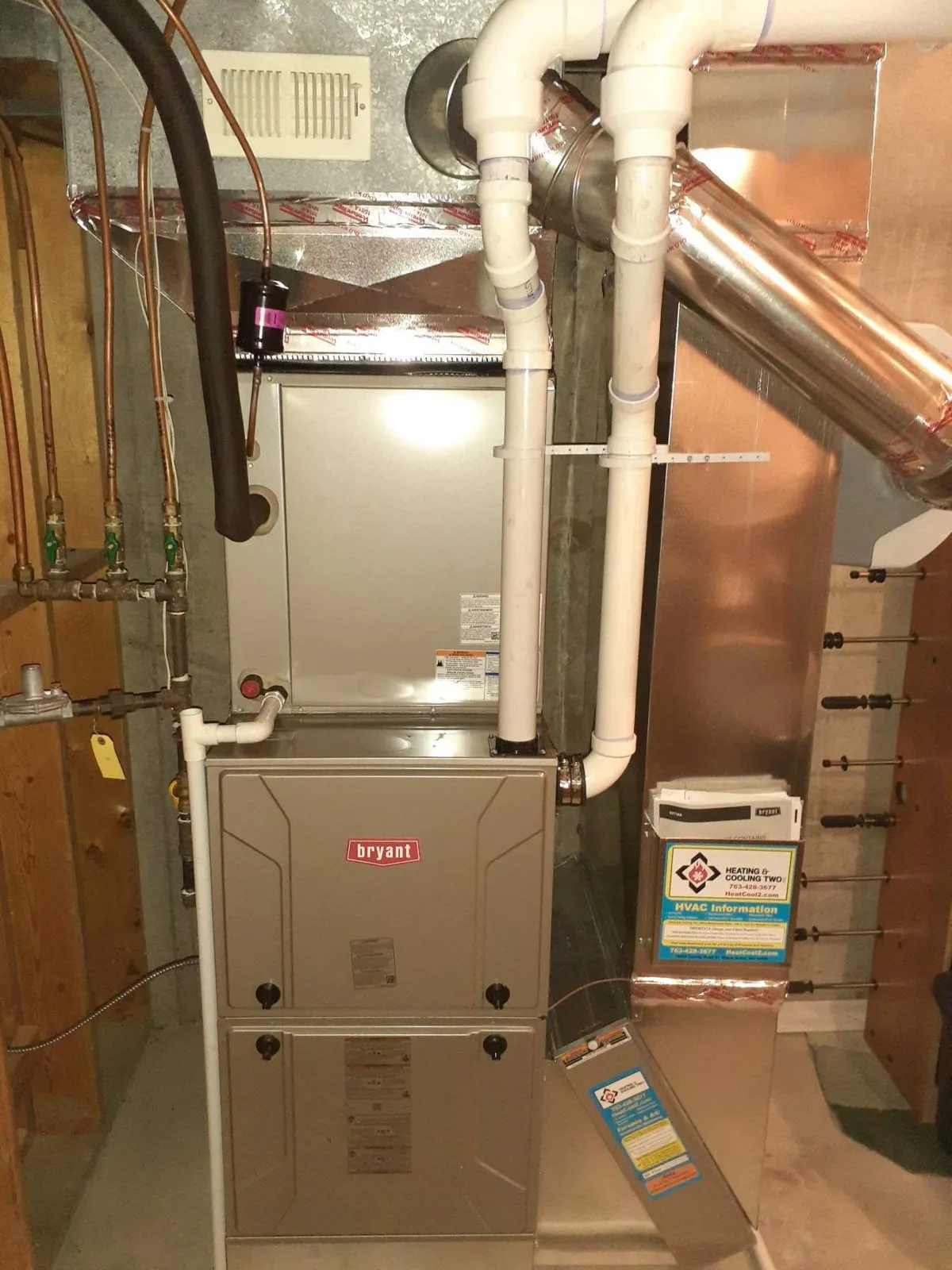 High-efficiency furnace and water heater in a finished Twin Cities basement