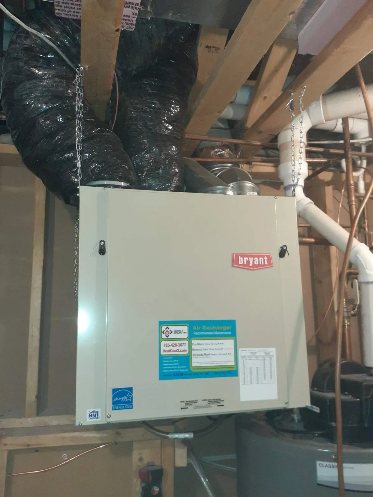 Ceiling-mounted gas garage heater installed in a Twin Cities home